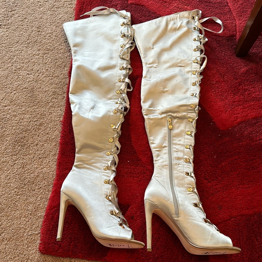 Sexy Cape Robbin boots. Satin w gold tie closure.
